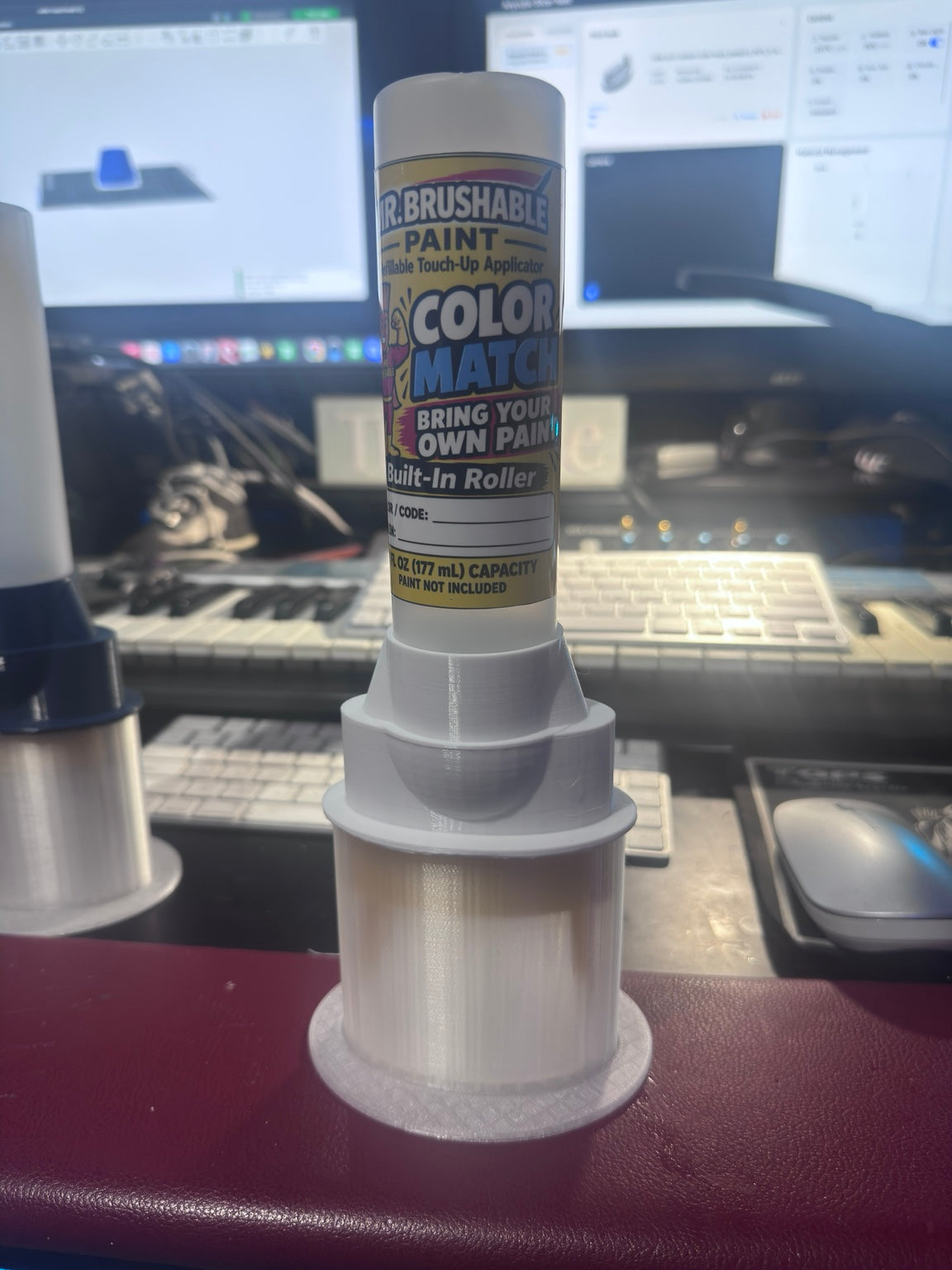Mr. Brushable 6 oz color match roller bottle on a desk