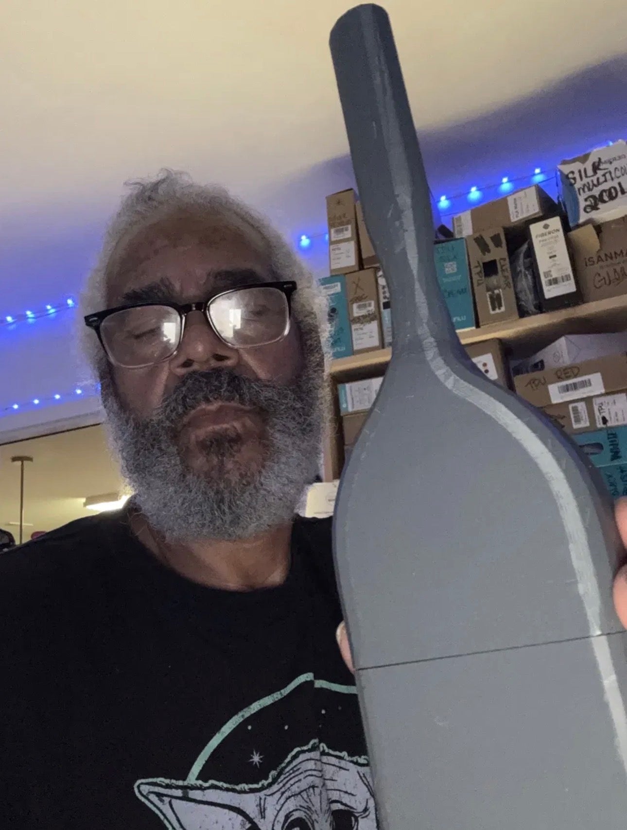 Inventor David Kermit Sparks, Sr. holding his first 3D-printed bottle with a built-in brush